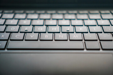 A close-up shot showcasing the intricate details of a modern keyboard. Perfect for tech-related content, emphasizing connectivity and modern work environments and computer components.
