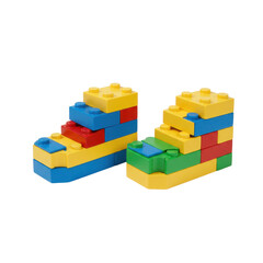 Colorful stacked building blocks arranged in two distinctive structures isolated on white background