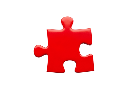 A vivid red puzzle piece stands out against a stark black background.