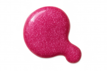 Glittery pink nail polish is spilled on a transparent background, creating a vibrant and textured blob of color