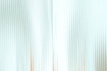 Obraz premium A soft, abstract background with vertical lines and a subtle gradient of light blue and white, creating a serene and airy atmosphere
