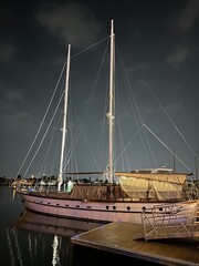 Sailboat Docked at Marina at Night
