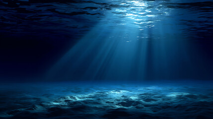 Fototapeta premium Sunlight penetrates the deep ocean, illuminating the sandy seabed with beams of blue light in a serene underwater scene