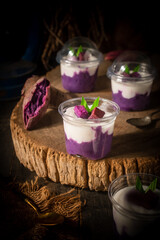 Traditional Thai dessert: mashed purple sweet potatoes topped with coconut milk