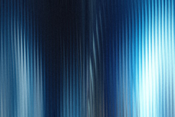 A dark blue textured background with vertical ribbed patterns and a bright light source on the right side, creating a dramatic gradient effect