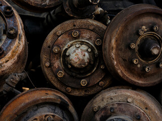 rusty car axles in junkyard