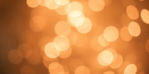 Obraz premium Warm amber and golden bokeh lights abstract background for festive and cozy ambiance