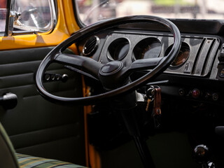 steering wheel detail of a vintage classic car