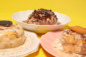 Three assorted gourmet cinnamon rolls with a shallow depth of field