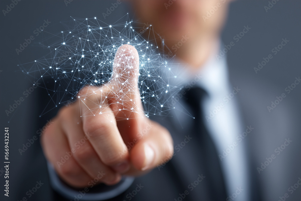 Poster a man in a suit is pointing at a computer screen with a finger