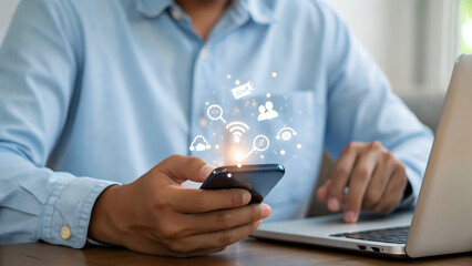 Engaged professional skillfully navigates digital world with smartphone and laptop, showcasing modern connectivity and data flow.