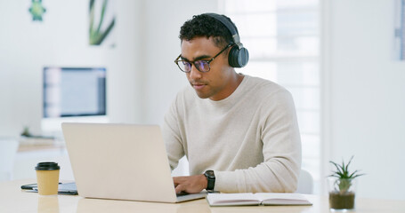Reading, laptop and headphones with business man in office for learning, webinar and demo walkthrough. Policy training, online orientation or streaming with person in agency for professional upskill