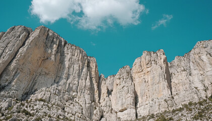 Fototapeta premium A breathtaking aerial view of the bucegi mountains in romania showcasing the dramatic cliff fa 