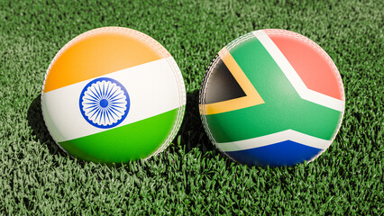 Two cricket balls featuring the flags of India and South Africa, on a grassy field