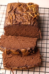 Chocolate brownies sprinkled with cheese on a cooling rack. Sweet cake. Sliced chocolate cake. 