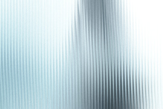 A textured background with vertical ribbed lines, creating a sense of depth and abstract pattern