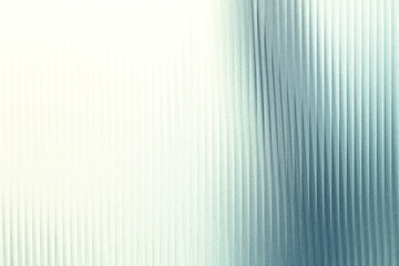 A textured surface with vertical lines, transitioning from a bright white to a cool blue hue, creating a subtle gradient effect