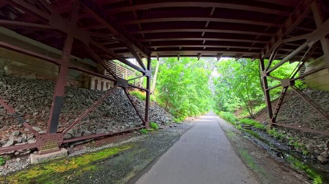 Walking beneath an underpass along the Middlesex Greenway in Metuchen, NJ