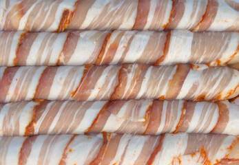 Sausages with beacon texture background. Fresh sausages with beacon. A pack of sausages