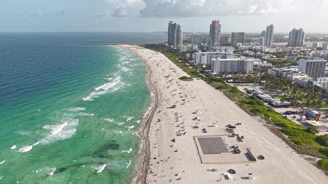 Aerial View of Miami Beach, Florida USA on Hot Sunny Day, Sand Waves and Buildings, Drone Shot