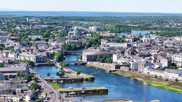 Beautiful view of Galway city historic old town and river. Sunny day in Ireland. Aerial