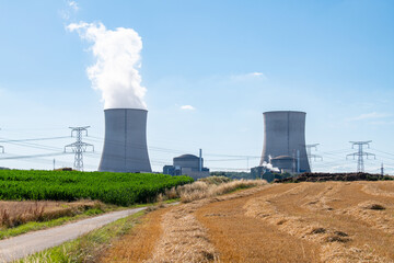 Nuclear power plant Cattenom in France, steaming cooling towers, air pollution, environment and...