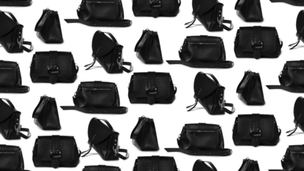 Black designer women's handbag with pattern.