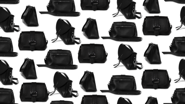 Black designer women's handbag with pattern.