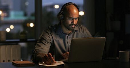 Man, laptop and night with feedback, video and notes for project management deadline in office....