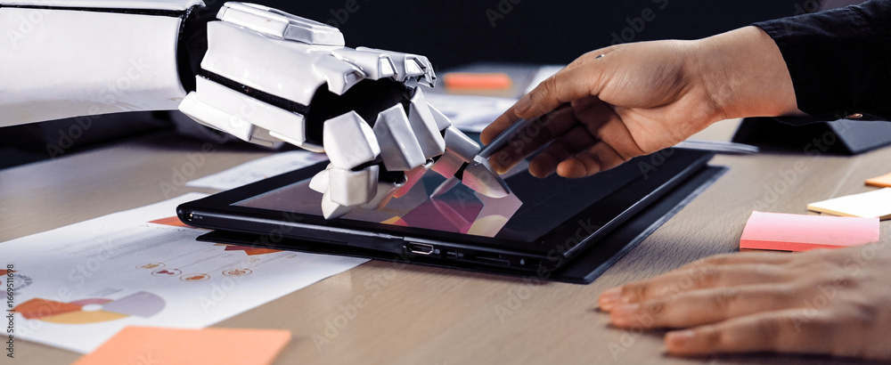 Poster a striking scene of a human hand interacting with a robotic hand over a digital tablet, symbolizing 