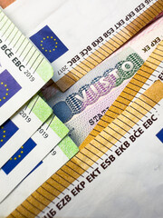 Visa stamp in passport closeup, European visitor visa at border control. Macro view of Schengen visa for tourism and travel in EU. Document for multiple entry. Legal immigration to Europe. High qualit