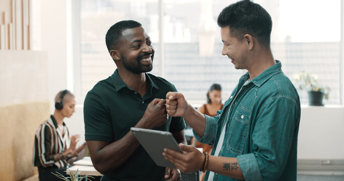 Business, fist bump and men in office, tablet and cooperation with graphic designer. People, creative agency and hand gesture in workplace, support and email with funding approval and - Powered by Adobe