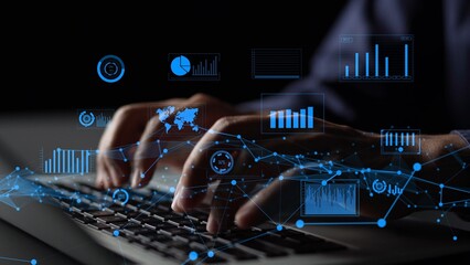 Close-up of hands typing on a keyboard surrounded by digital data visualization elements,...