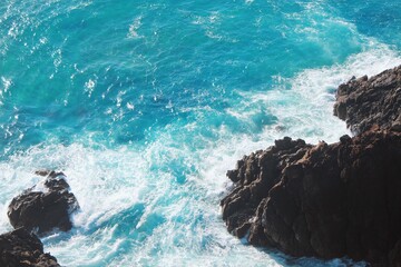 waves crashing on rocks