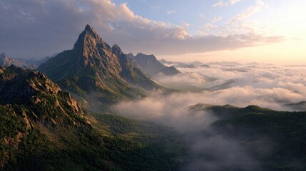 Mountain range shrouded in clouds at sunrise