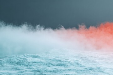 Obraz premium Chilling horizon with a blue, wavy surface meeting a dense fog, colored pale blue and red against a dark sky