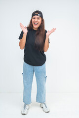 Excited young boyish woman raising her hands near her face, smiling with delight. Isolated on a...