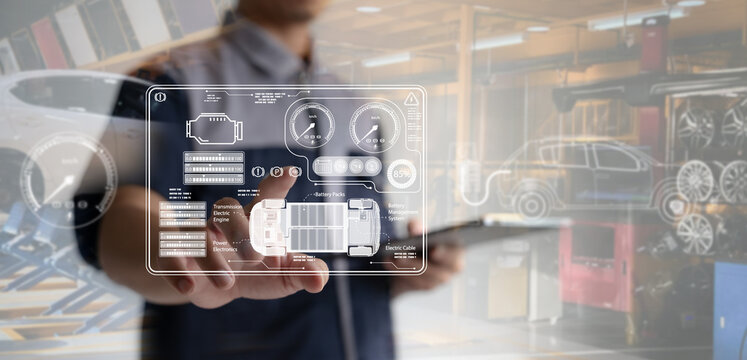 Auto mechanics use tablets with state-of-the-art interactive diagnostic software to find faulty parts in an engine.