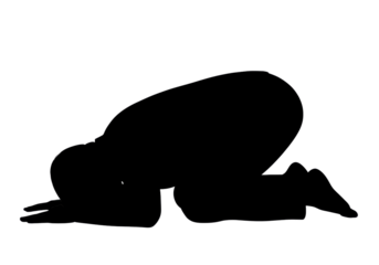 Silhouette of a person kneeling in a prayer position
