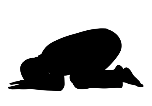 Silhouette of a person kneeling in a prayer position
