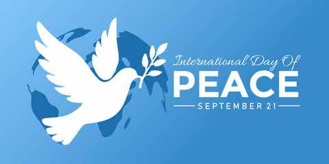 International Day of Peace banner. Illustration of a white dove carrying an olive branch with the globe in the background on a blue backdrop.
