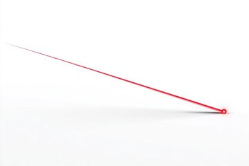 Red laser beam emitted from a point, against white backdrop. Minimalist, clean