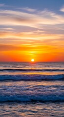Vibrant sunset over the ocean with colorful clouds and gentle waves creating a breathtaking seascape