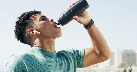 Drinking water, outdoor and man with workout hydration and break with wellness, exercise and...