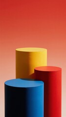 Fototapeta premium Three Cylinders in Blue, Red, and Yellow Against a Gradient Orange Background