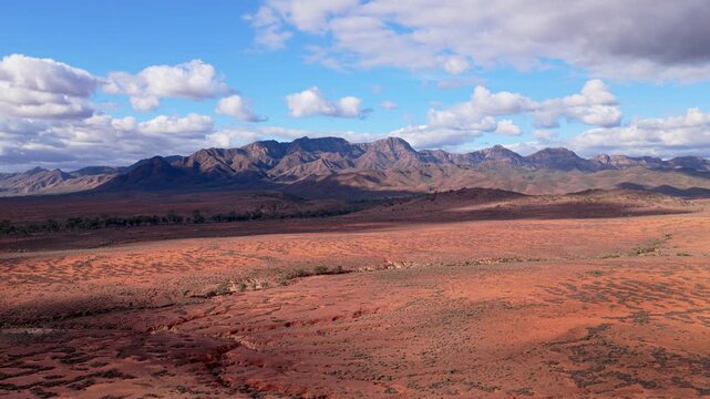 Drone shot of Flinders Ranges desert and mountains with cloudy sky, South Australia