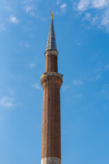 close-up of a minaret against a blue sky