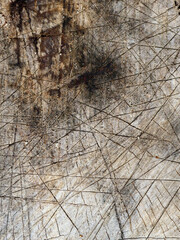 Grungy, weathered wood texture with scratches.