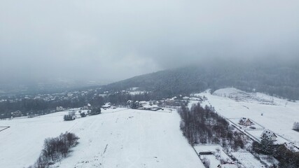 Obraz premium Winter aerial view of snow-covered countryside