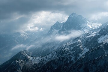 Majestic mountain landscapes in Austria with dramatic clouds and rugged peaks under a moody sky during late afternoon light